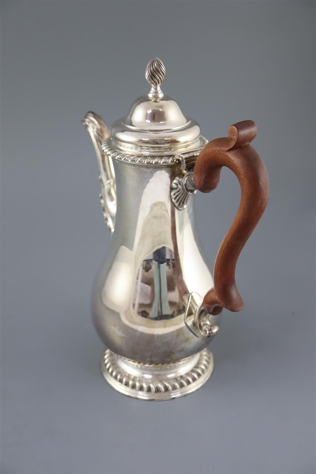 A modern 18th century style silver baluster coffee pot, by Spink & Son, gross 36oz.